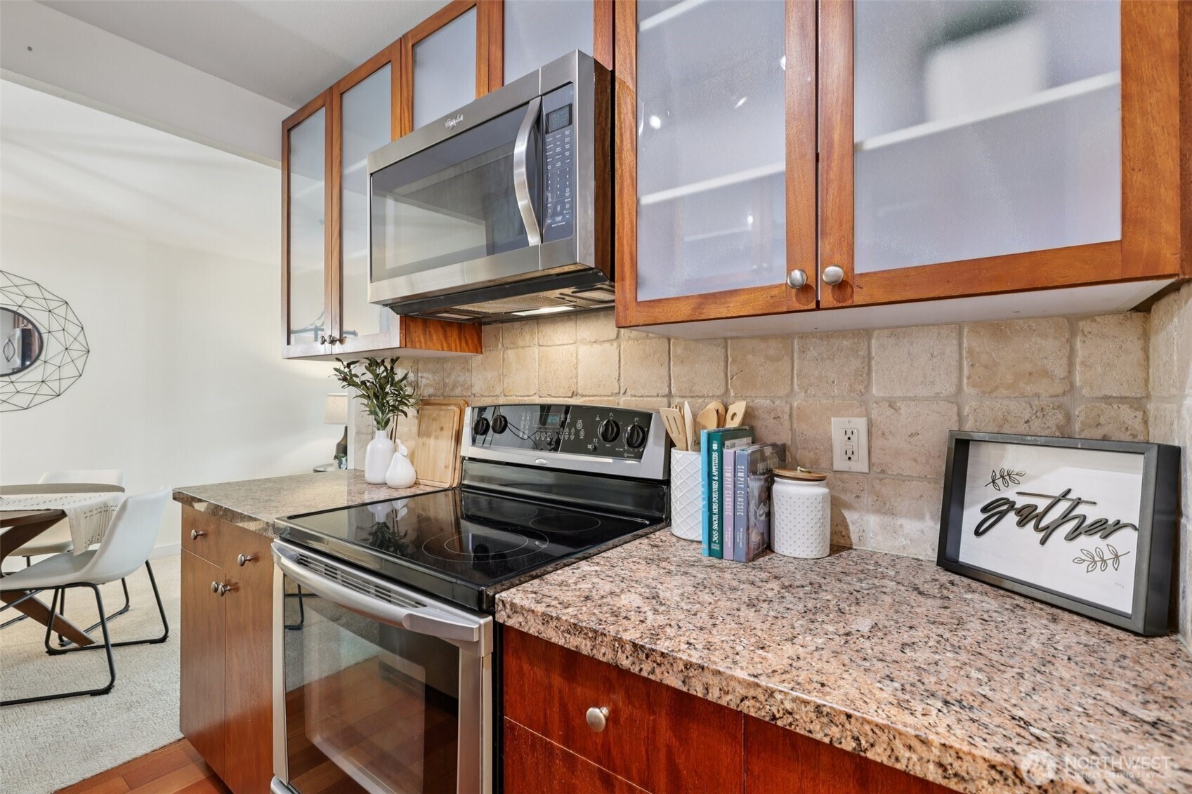 960 5th Avenue South, Unit 208 Edmonds, WA 98020 - Photo 6 of 26 a kitchen with a stove and a microwave