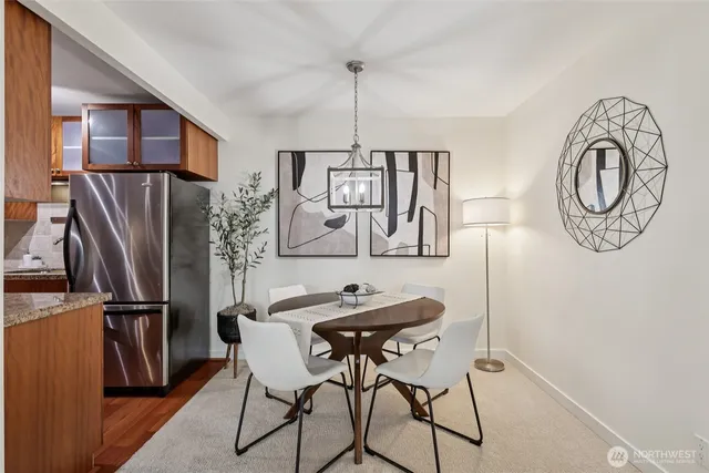 a view of a dining room with furniture window and wooden floor