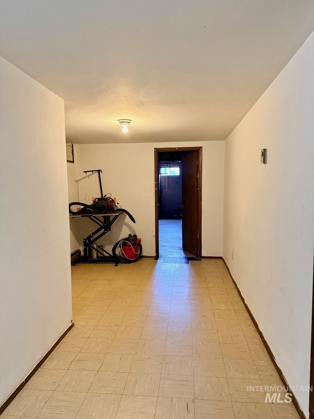 402 Cedar Drive Pierce, ID 83546 - Photo 18 of 24 Hallway with light floors and baseboards