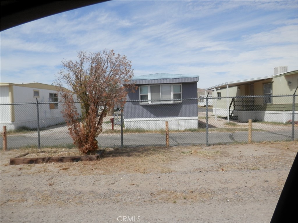0 Calico Boulevard Yermo, CA 92398 - Photo 5 of 12 a view of a livingroom with a chair and the tree