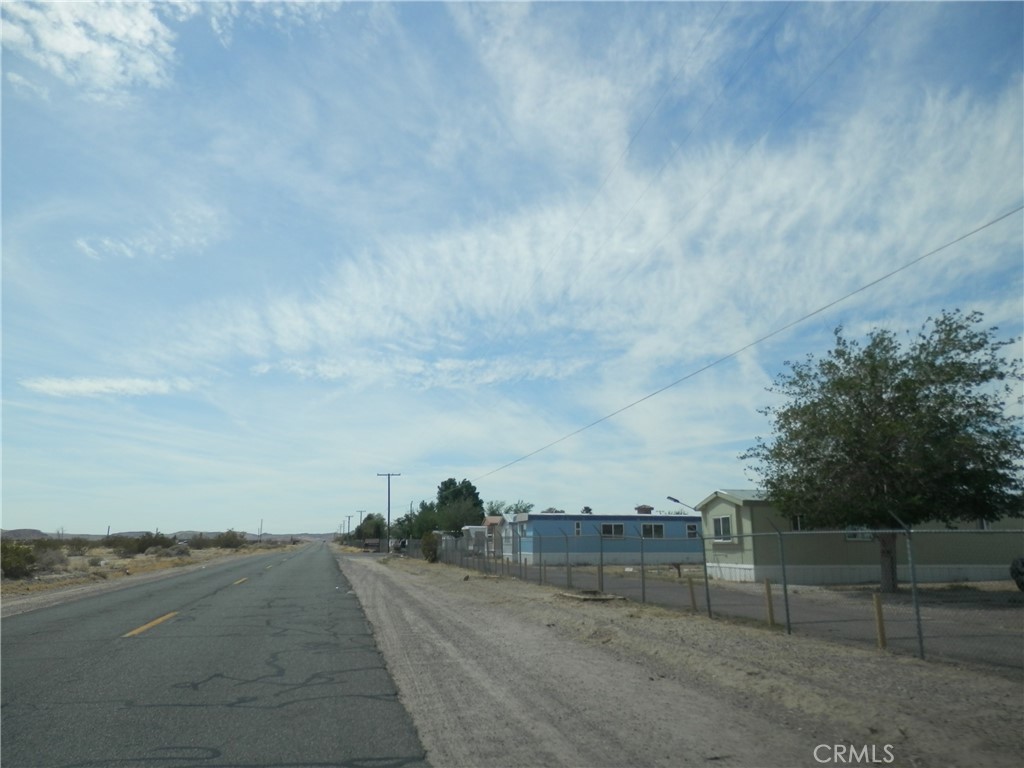 0 Calico Boulevard Yermo, CA 92398 - Photo 6 of 12 a view of a dry yard with wooden fence