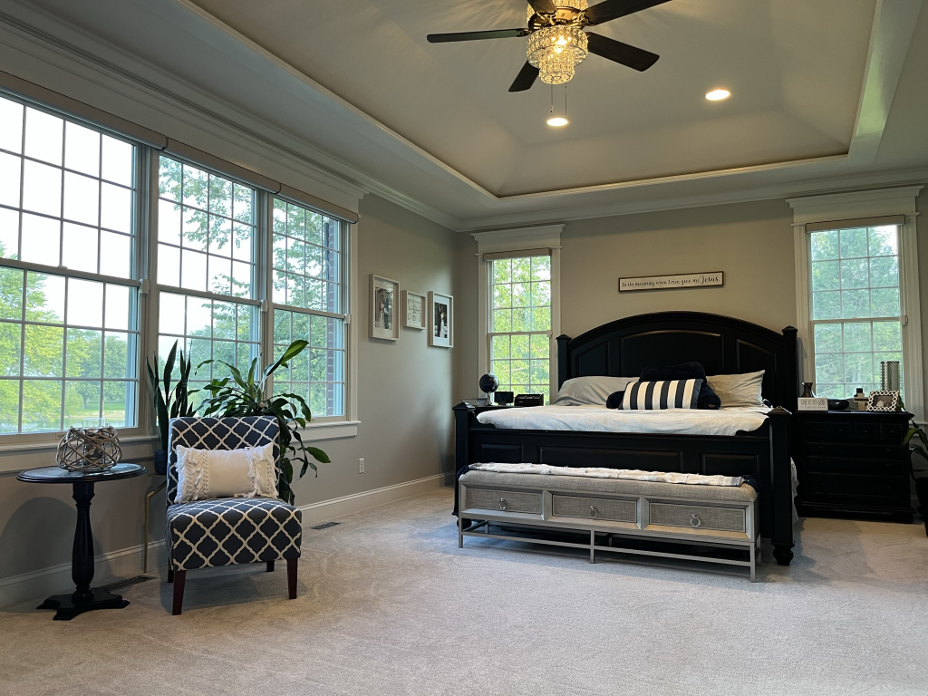 12747 Harrold Point Road Wapella, IL 61777 - Photo 18 of 48 a bedroom with a bed and a couch