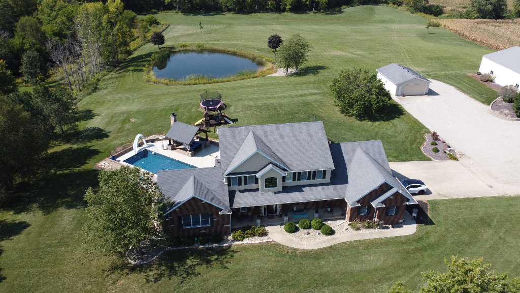 12747 Harrold Point Road Wapella, IL 61777 - Photo 2 of 48 an aerial view of a house with swimming pool garden and outdoor seating