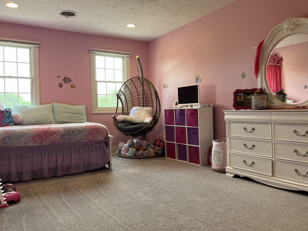 12747 Harrold Point Road Wapella, IL 61777 - Photo 26 of 48 a bedroom with a bed and a dresser