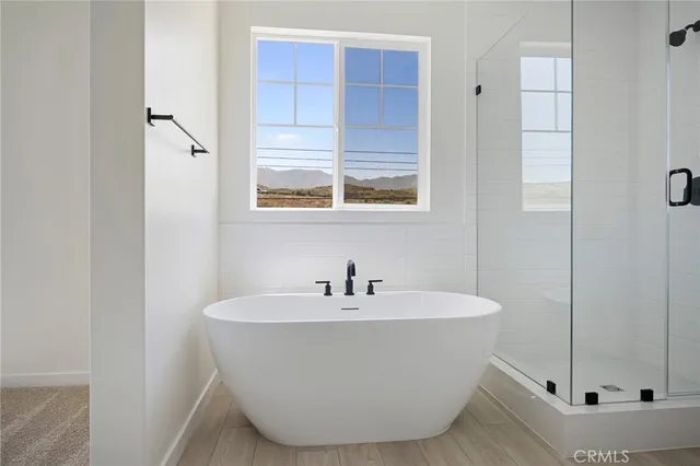 a white bath tub sitting in a bathroom