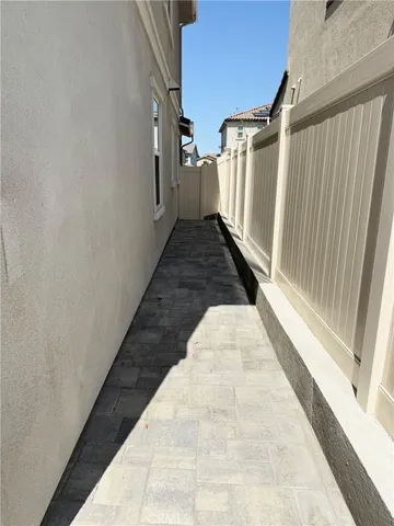 a view of a patio with wooden floor