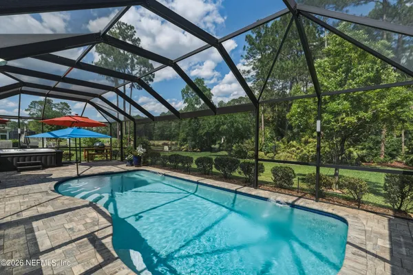 a view of a swimming pool with a patio