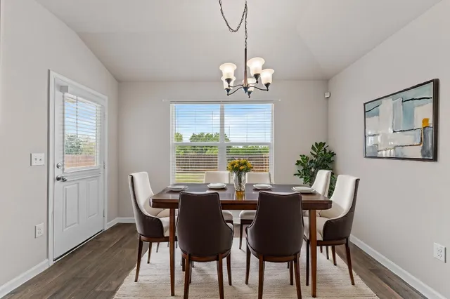a view of a dining room with furniture window and outside view