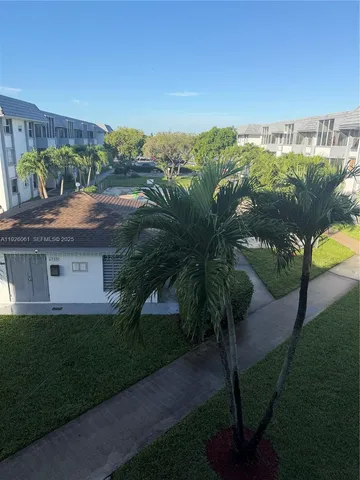 a view of a yard in front of a house