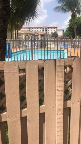 a view of a yard with a tree