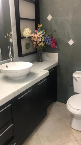 a bathroom with a sink and a toilet