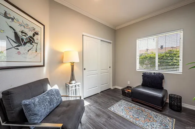 a living room with furniture and a rug