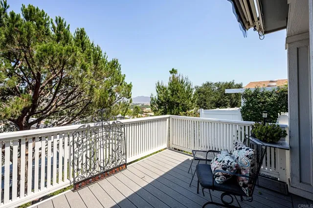 a view of a table and chairs on the roof deck