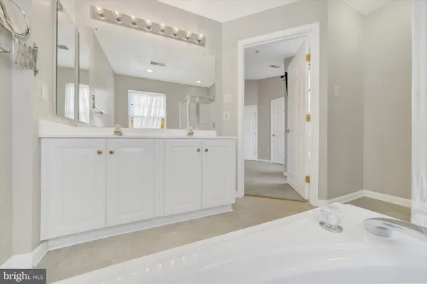 wooden floor with white cabinet