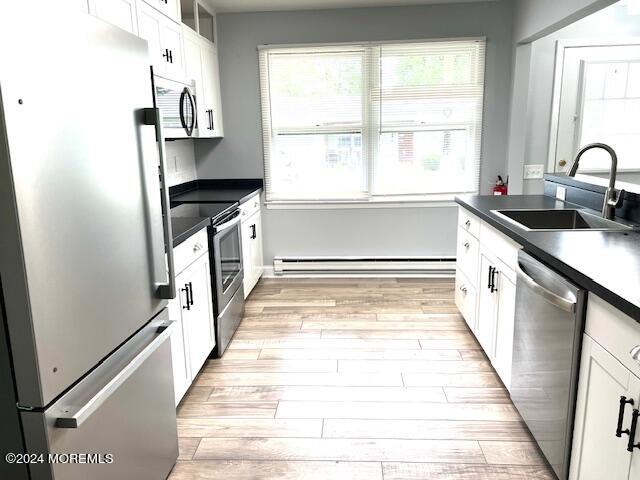 8 Augusta Road, Unit 73 Whiting, NJ 08759 - Photo 13 of 22 a kitchen with stainless steel appliances granite countertop a sink and a stove