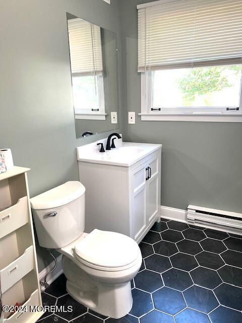 8 Augusta Road, Unit 73 Whiting, NJ 08759 - Photo 19 of 22 a bathroom with a sink a toilet and a window