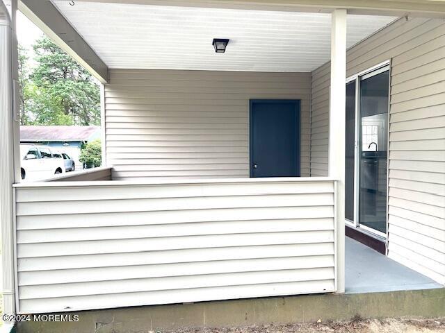 8 Augusta Road, Unit 73 Whiting, NJ 08759 - Photo 21 of 22 a view of a balcony with chair