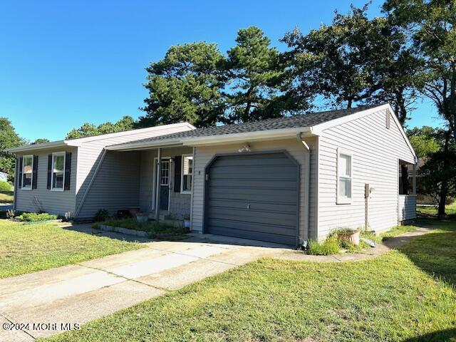 8 Augusta Road, Unit 73 Whiting, NJ 08759 - Photo 22 of 22 a front view of a house with a yard