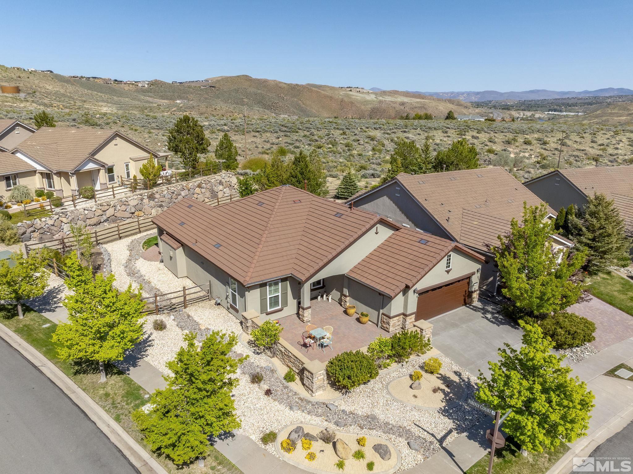 1005 Meridian Ranch Drive Reno, NV 89523 - Photo 3 of 40 an aerial view of residential houses with outdoor space and trees