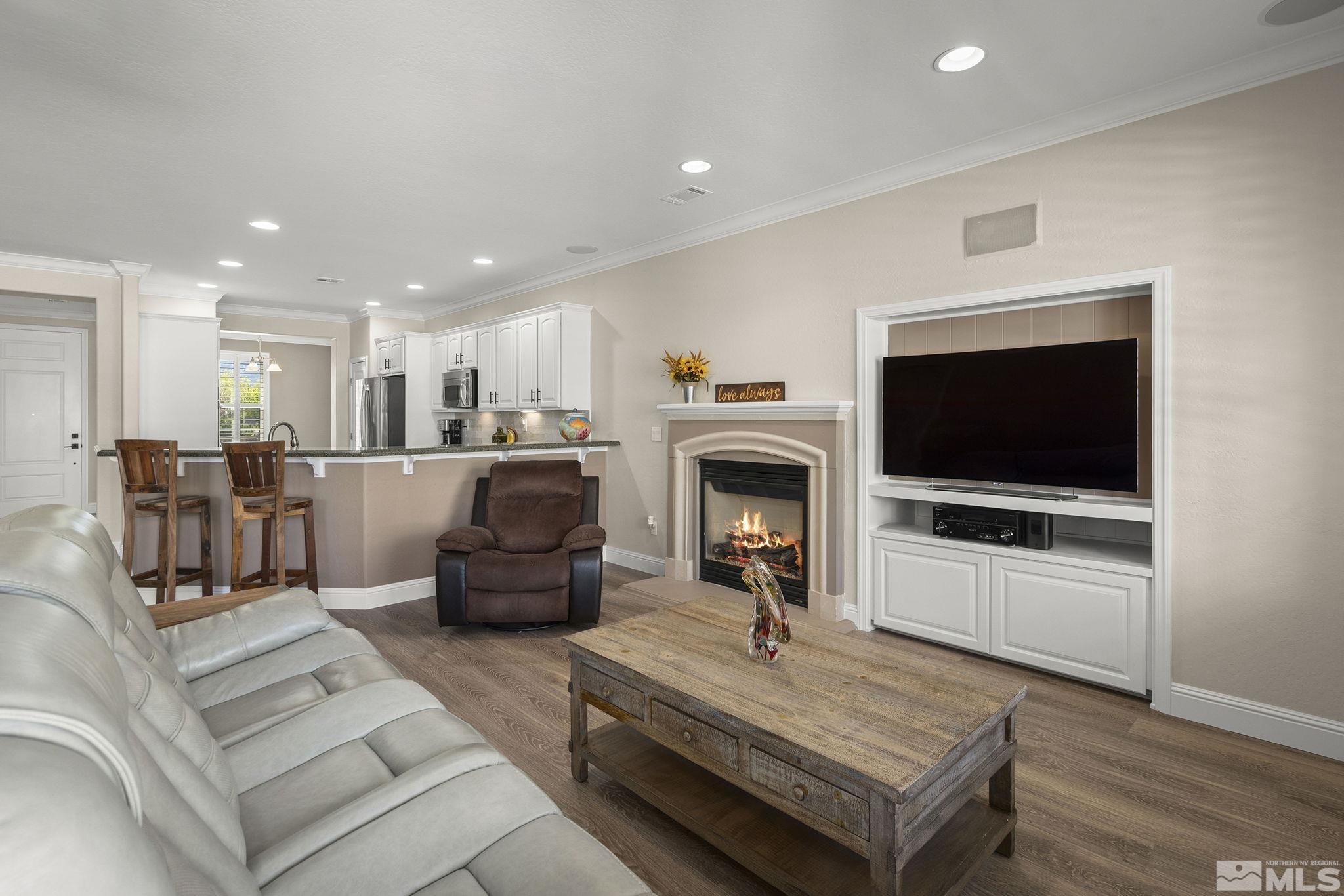 1005 Meridian Ranch Drive Reno, NV 89523 - Photo 8 of 40 a living room with furniture and a flat screen tv