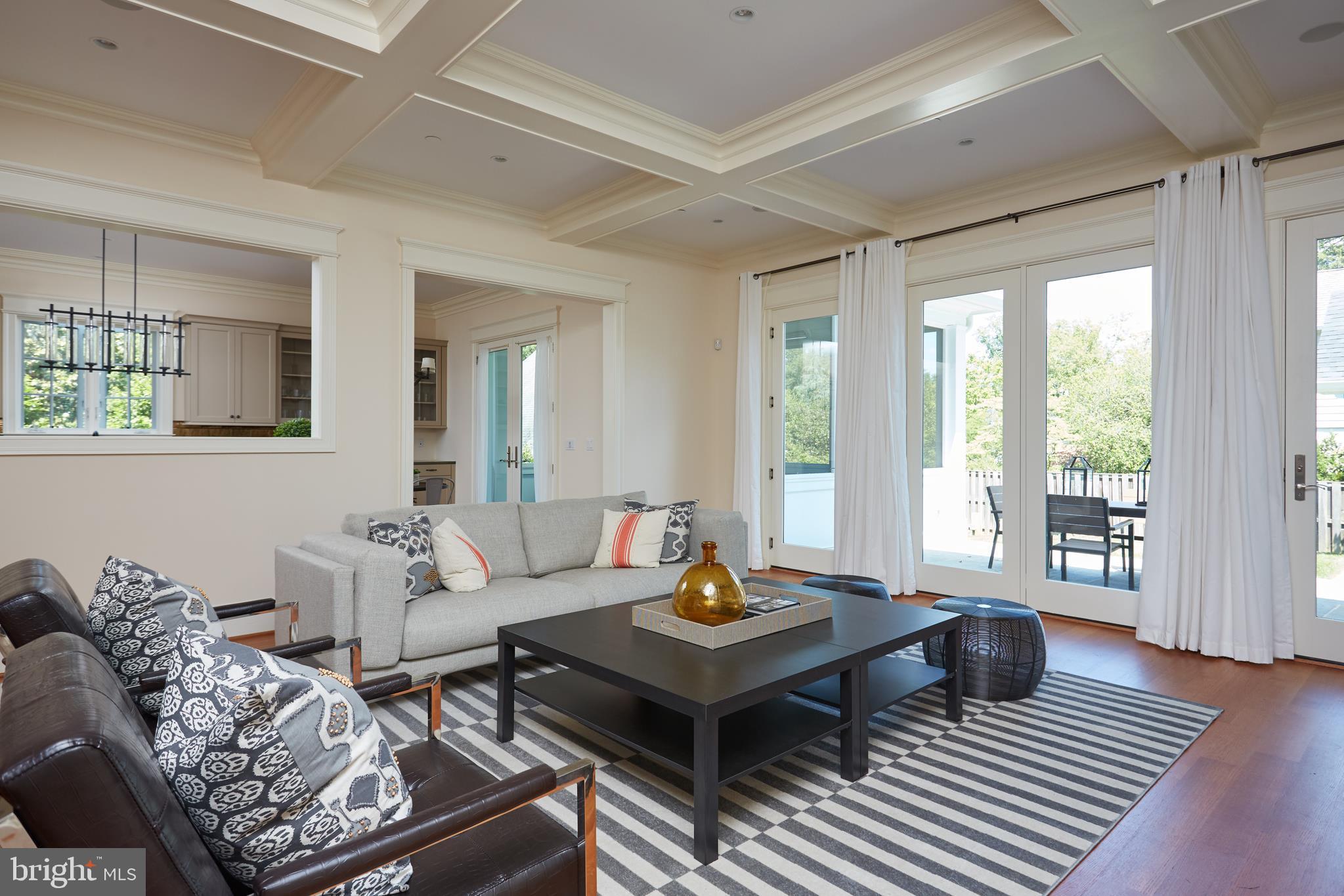 8003 Maple Ridge Road Bethesda, MD 20814 - Photo 11 of 30 a living room with furniture and a table