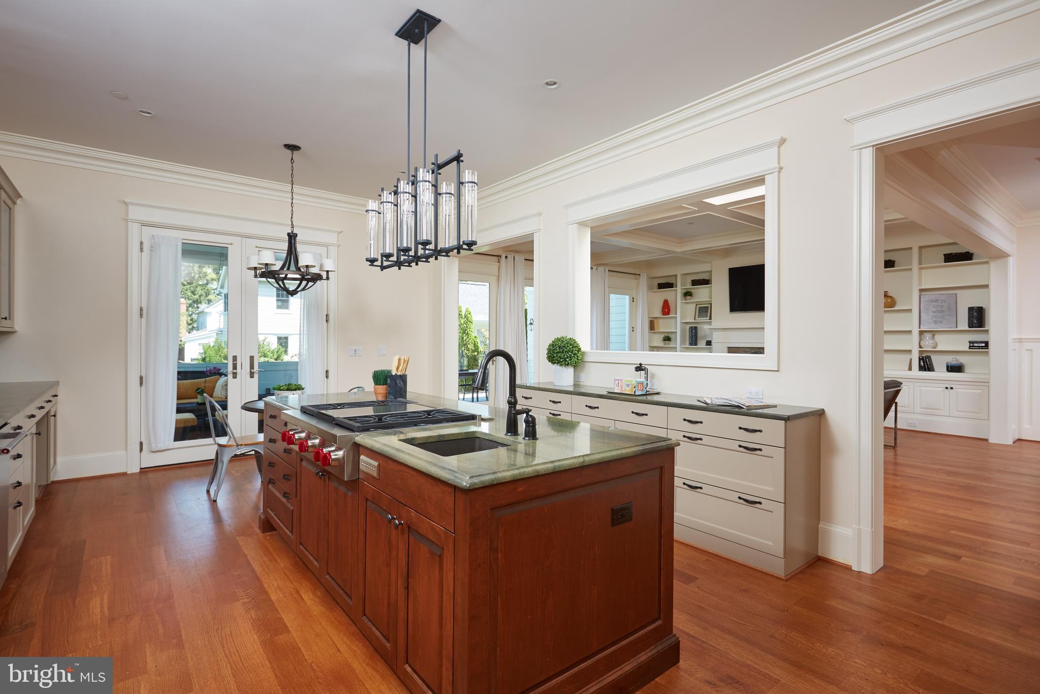 8003 Maple Ridge Road Bethesda, MD 20814 - Photo 14 of 30 a kitchen with sink stove and wooden floor