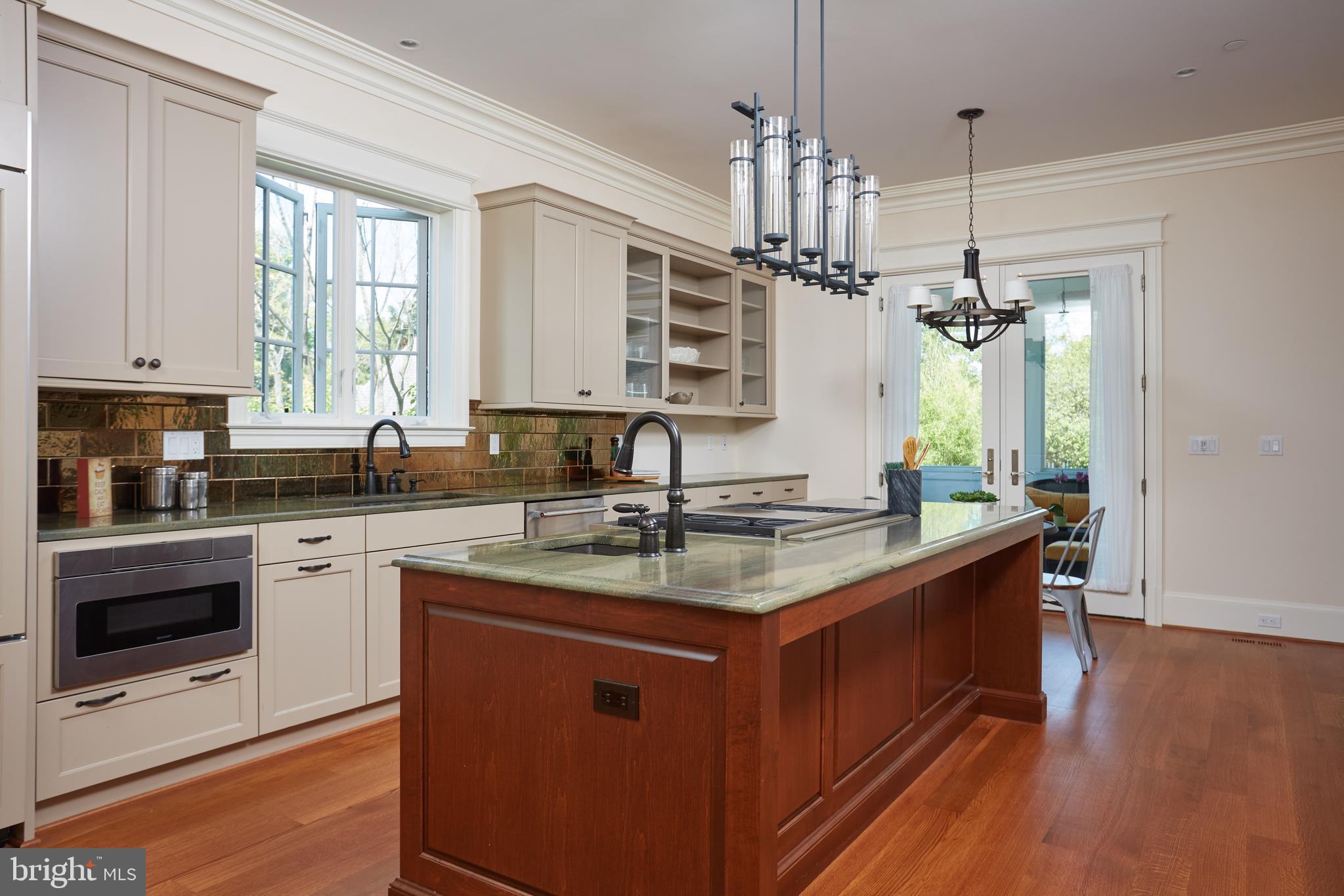 8003 Maple Ridge Road Bethesda, MD 20814 - Photo 15 of 30 a kitchen with stainless steel appliances granite countertop a sink stove and refrigerator