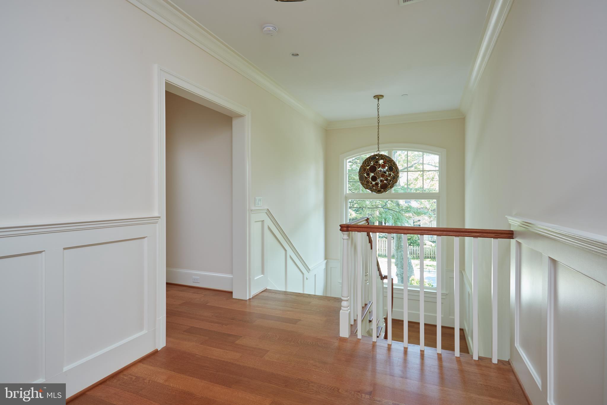 8003 Maple Ridge Road Bethesda, MD 20814 - Photo 16 of 30 a view of a hallway with windows