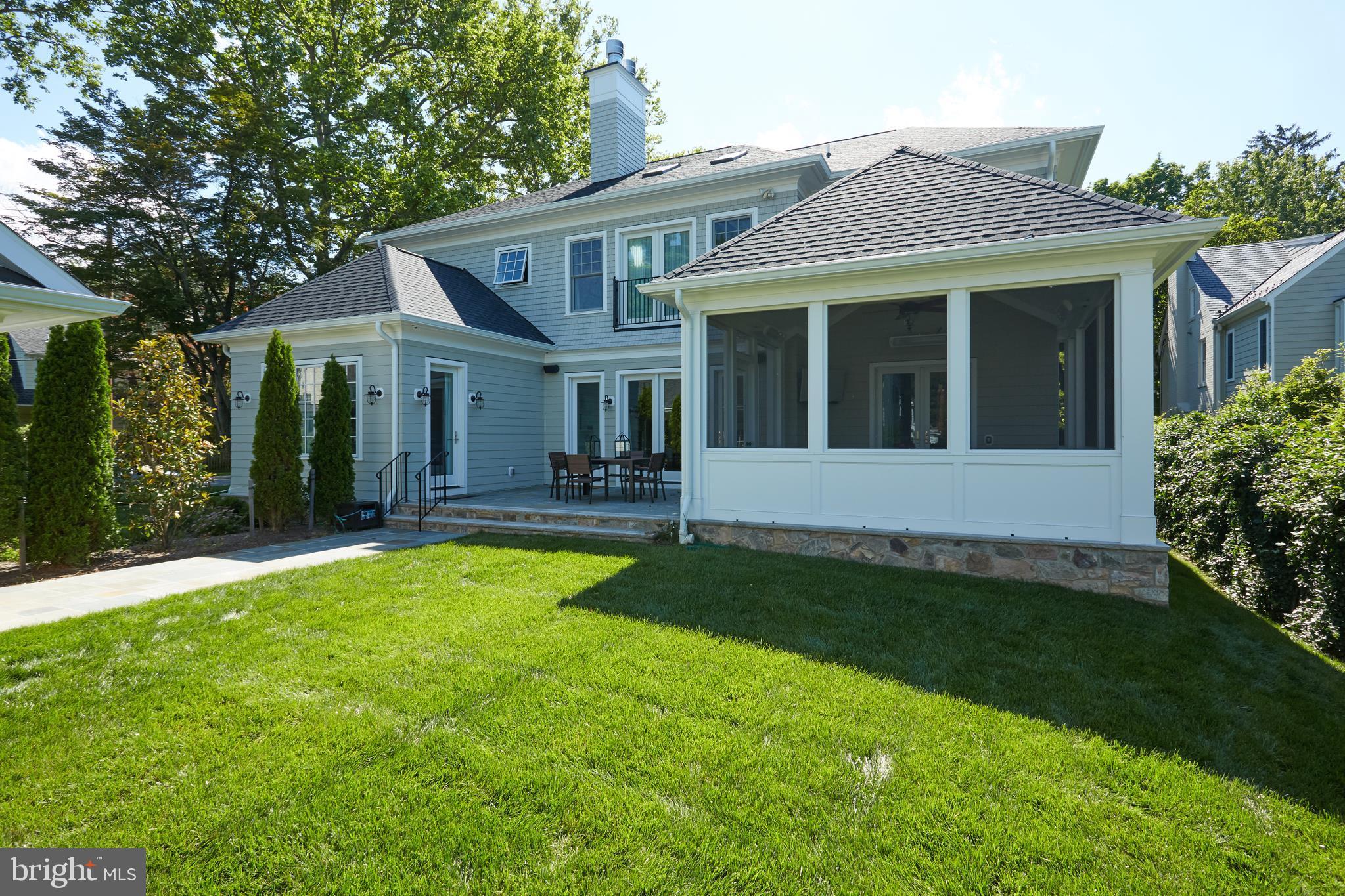 8003 Maple Ridge Road Bethesda, MD 20814 - Photo 24 of 30 a view of a house with a yard and plants