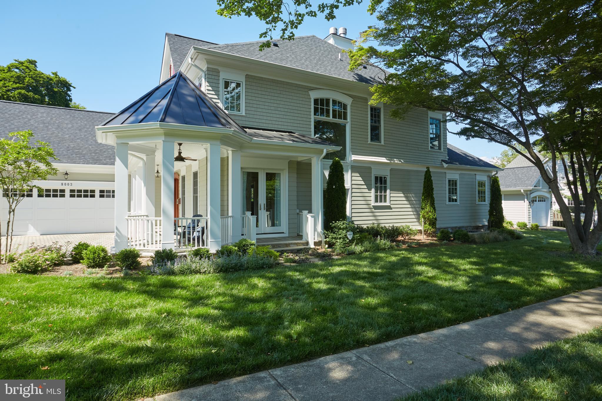 8003 Maple Ridge Road Bethesda, MD 20814 - Photo 26 of 30 a front view of a house with a garden
