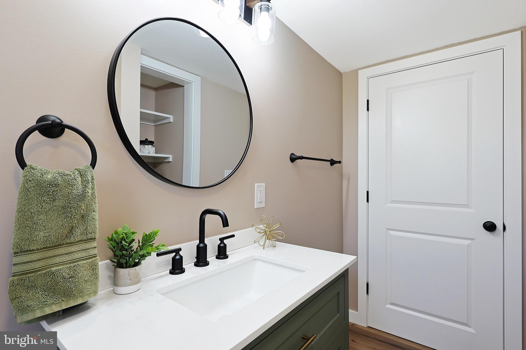 502 Sol Shanholtz Road Augusta, WV 26704 - Photo 25 of 61 a bathroom with a sink and a mirror