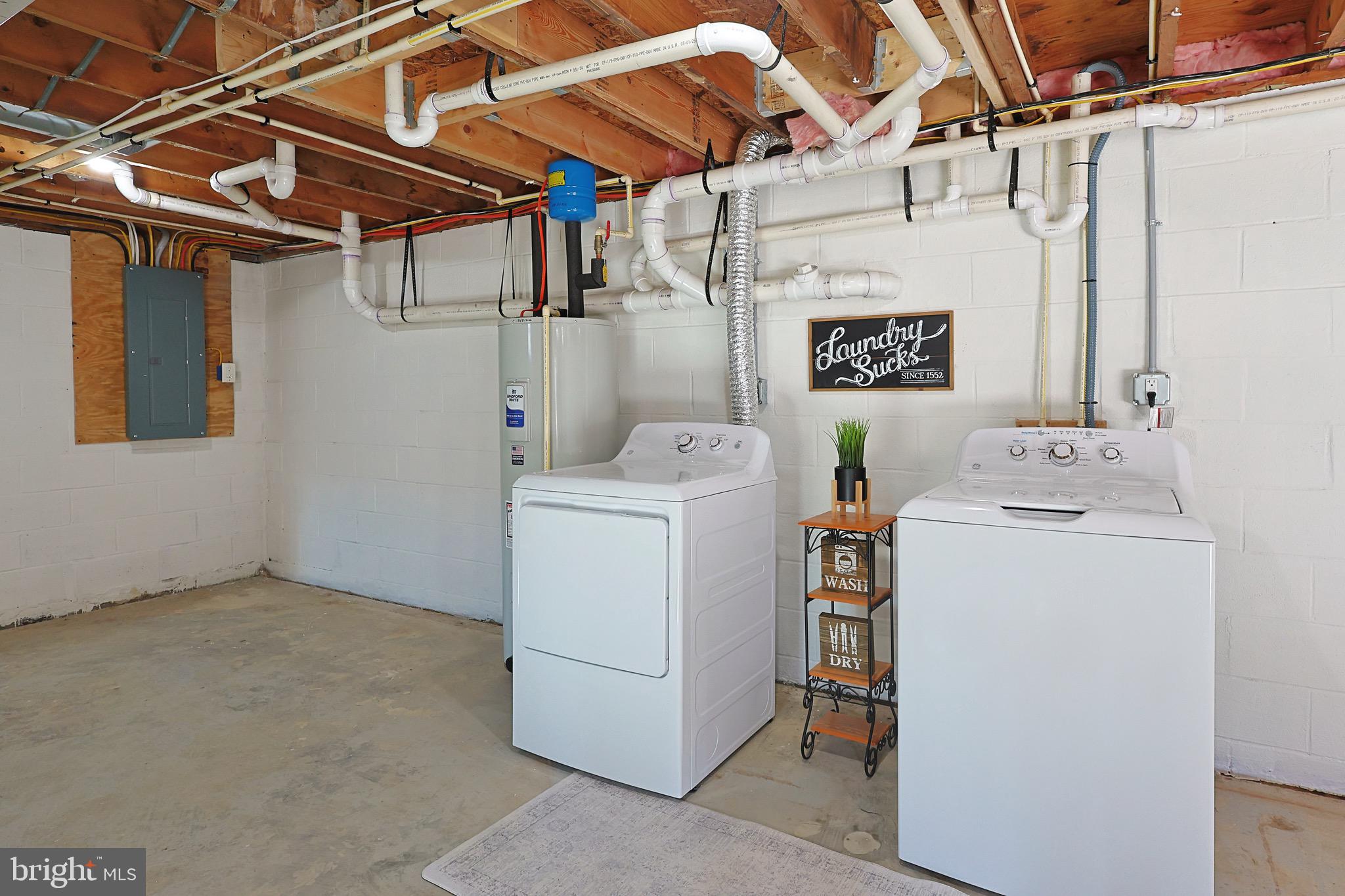 502 Sol Shanholtz Road Augusta, WV 26704 - Photo 40 of 61 a utility room with dryer and washer
