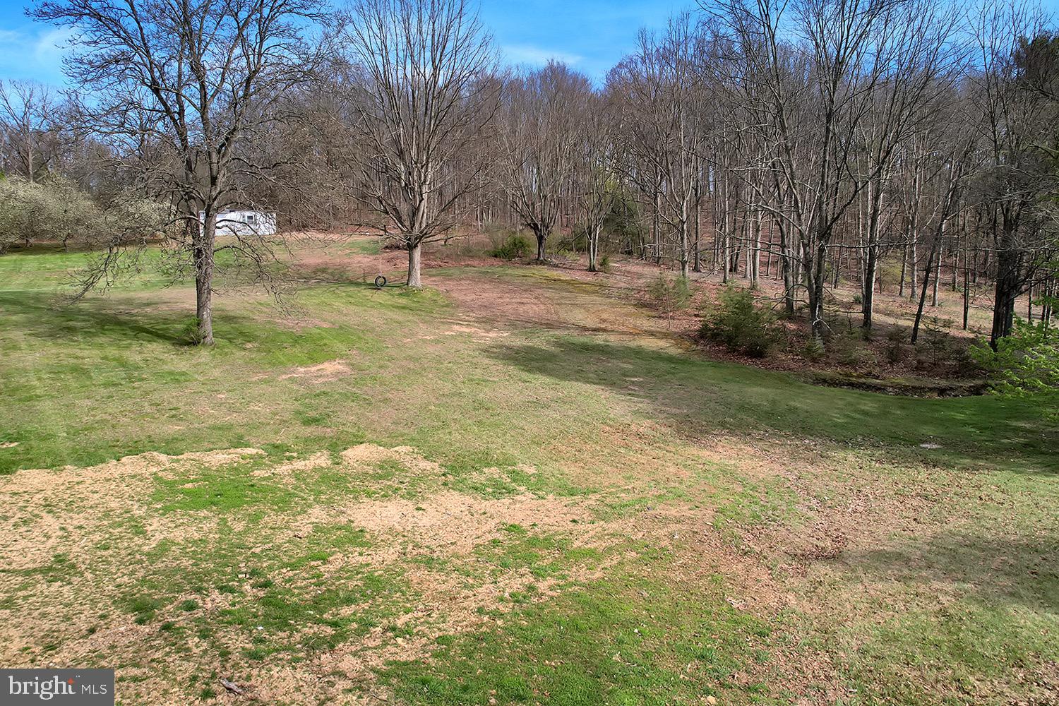 502 Sol Shanholtz Road Augusta, WV 26704 - Photo 57 of 61 a backyard of a house with lots of green space