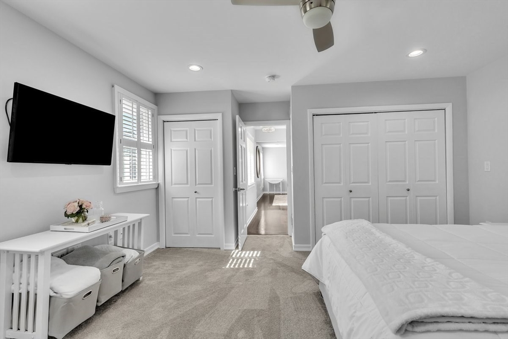 6 Strathmore Road Dartmouth, MA 02747 - Photo 27 of 38 a bedroom with a bed and a flat screen tv