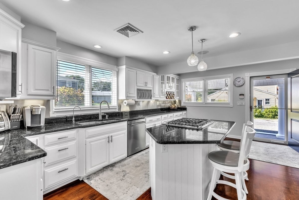 6 Strathmore Road Dartmouth, MA 02747 - Photo 9 of 38 a kitchen with granite countertop appliances cabinets and a large window