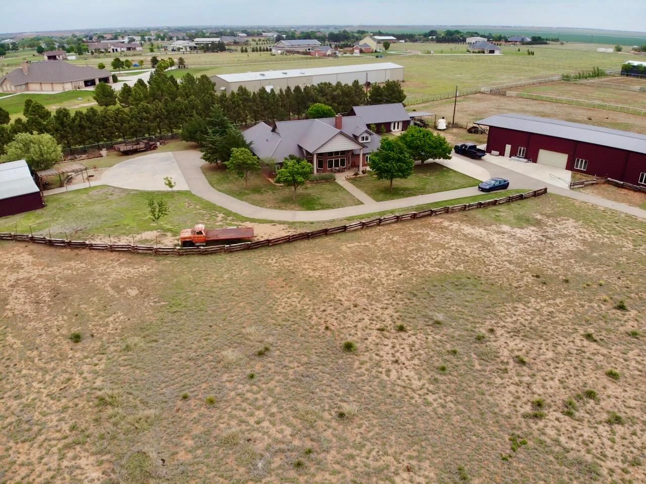 9002 Woodrow Road Wolfforth, TX 79382 - Photo 46 of 48 an aerial view of a houses with outdoor space