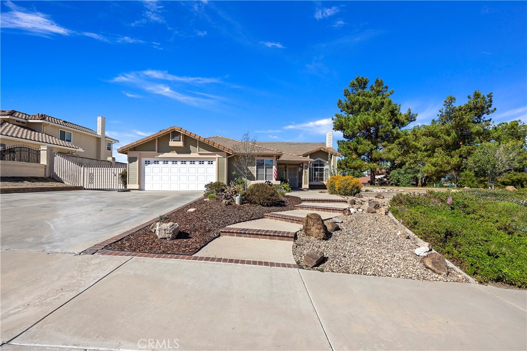 6753 Ridgeside Drive Riverside, CA 92506 - Photo 1 of 1 a front view of a house with a yard