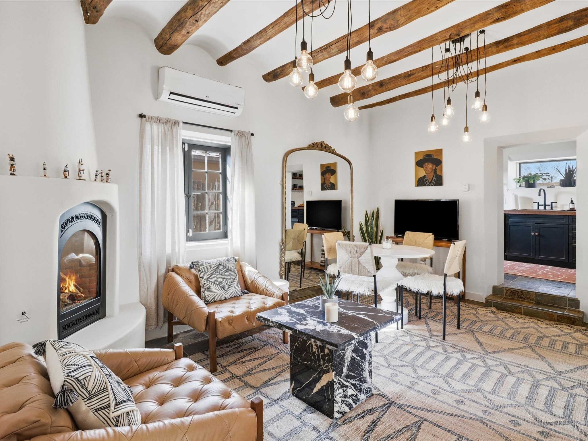 824 Dunlap Street, Unit A Santa Fe, NM 87501 - Photo 1 of 1 Just right of the entry: living room with classic Viga beams.
