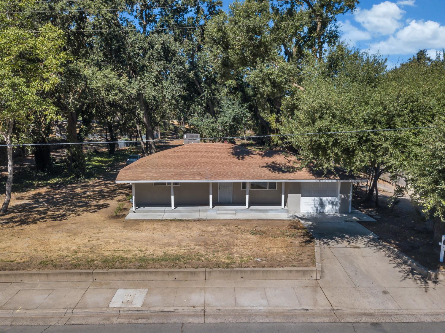5720 Riverside Boulevard Sacramento, CA 95822 - Photo 21 of 54 a house with trees in the background