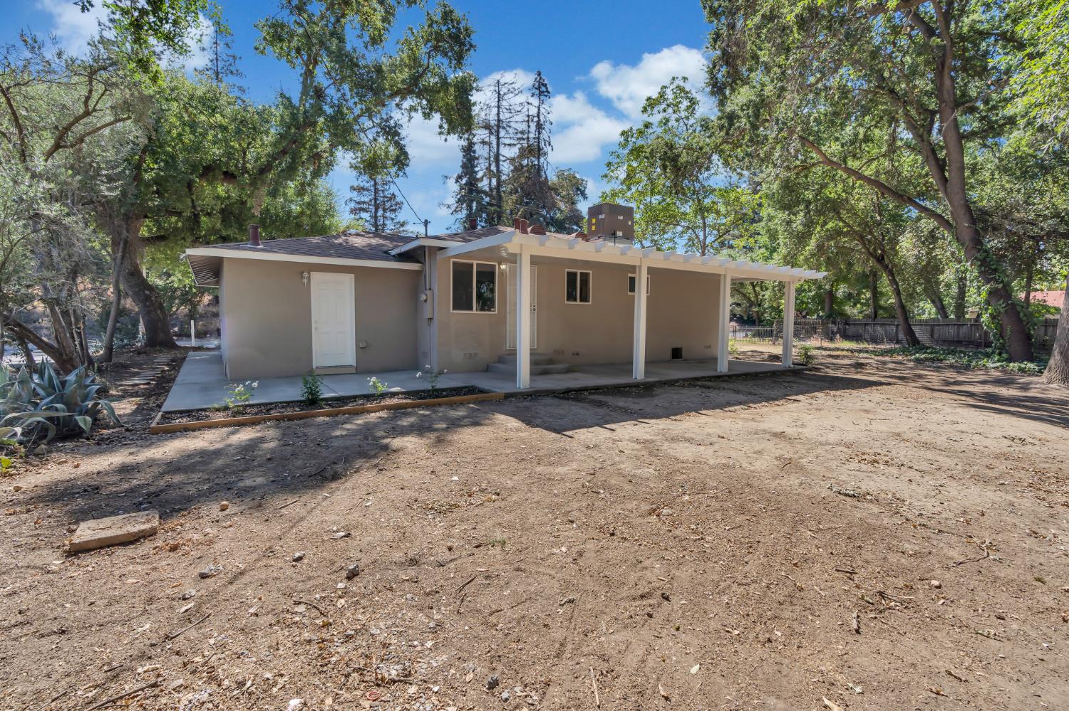 5720 Riverside Boulevard Sacramento, CA 95822 - Photo 23 of 54 a view of a house with a yard