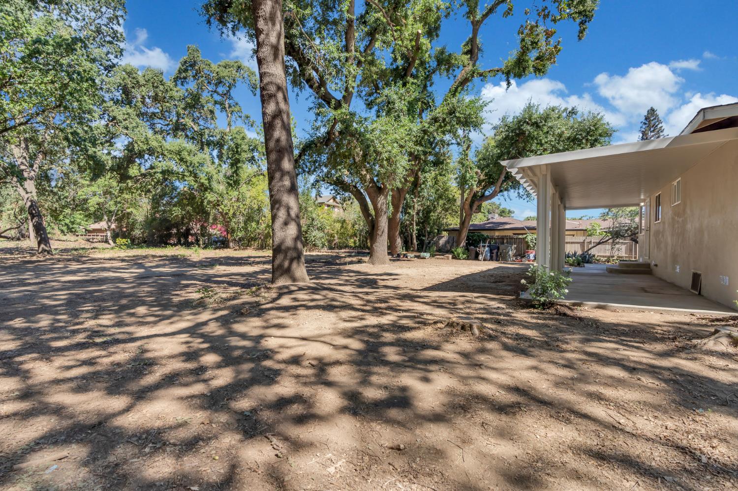 5720 Riverside Boulevard Sacramento, CA 95822 - Photo 26 of 54 a view of road with large trees