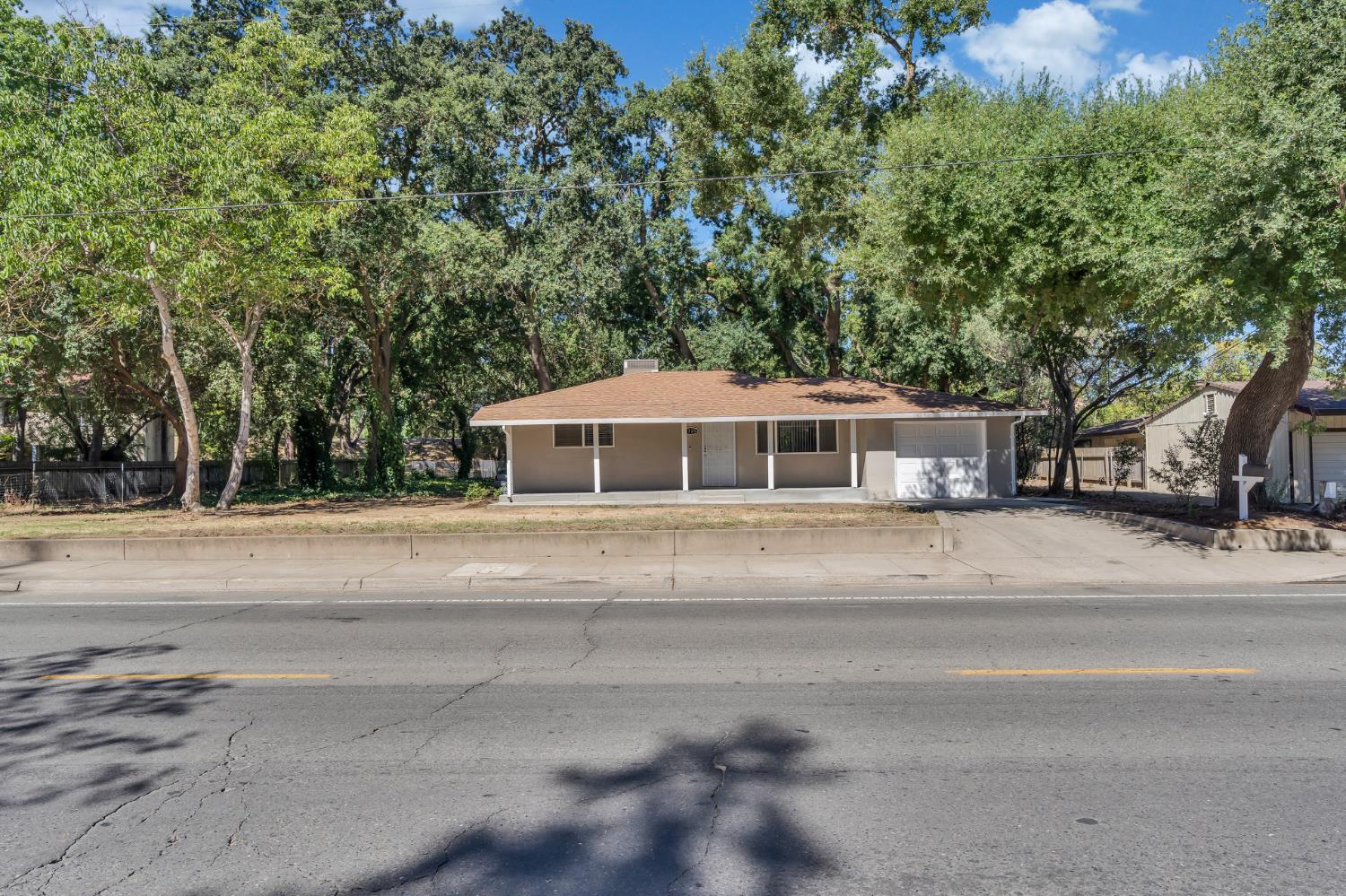 5720 Riverside Boulevard Sacramento, CA 95822 - Photo 29 of 54 a front view of a house with a yard