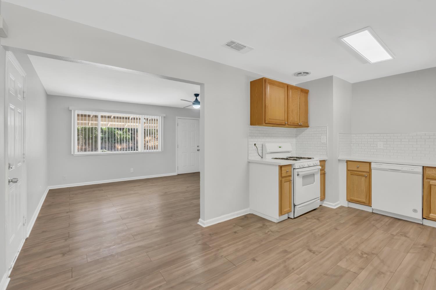 5720 Riverside Boulevard Sacramento, CA 95822 - Photo 31 of 54 a view of a kitchen with wooden floor and a window