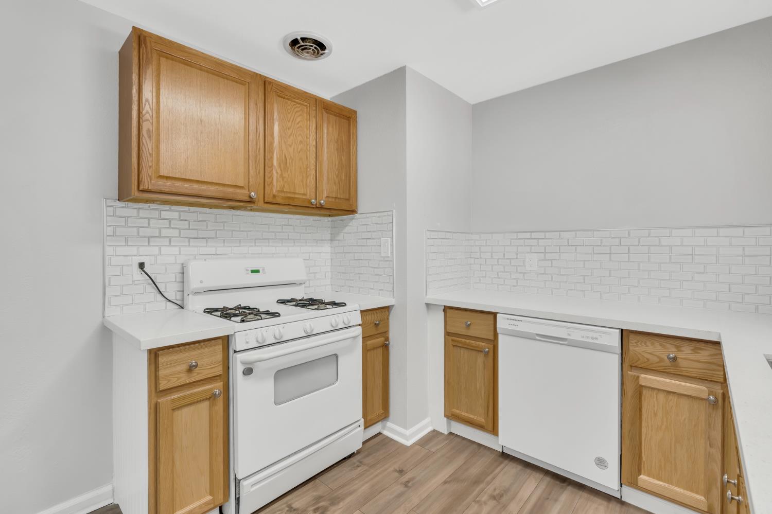 5720 Riverside Boulevard Sacramento, CA 95822 - Photo 34 of 54 a kitchen with a stove and a microwave