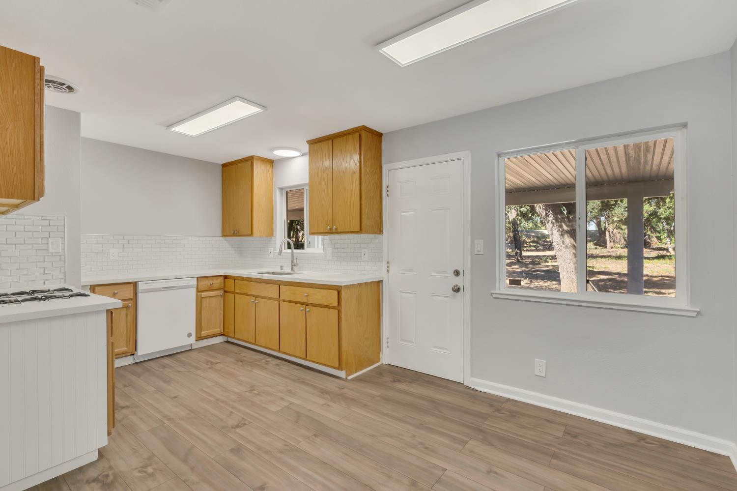 5720 Riverside Boulevard Sacramento, CA 95822 - Photo 35 of 54 a view of a kitchen counter space and wooden floor