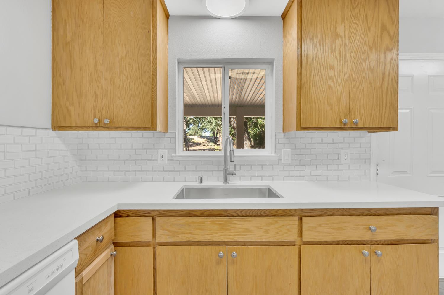 5720 Riverside Boulevard Sacramento, CA 95822 - Photo 36 of 54 a bathroom with a sink and a window