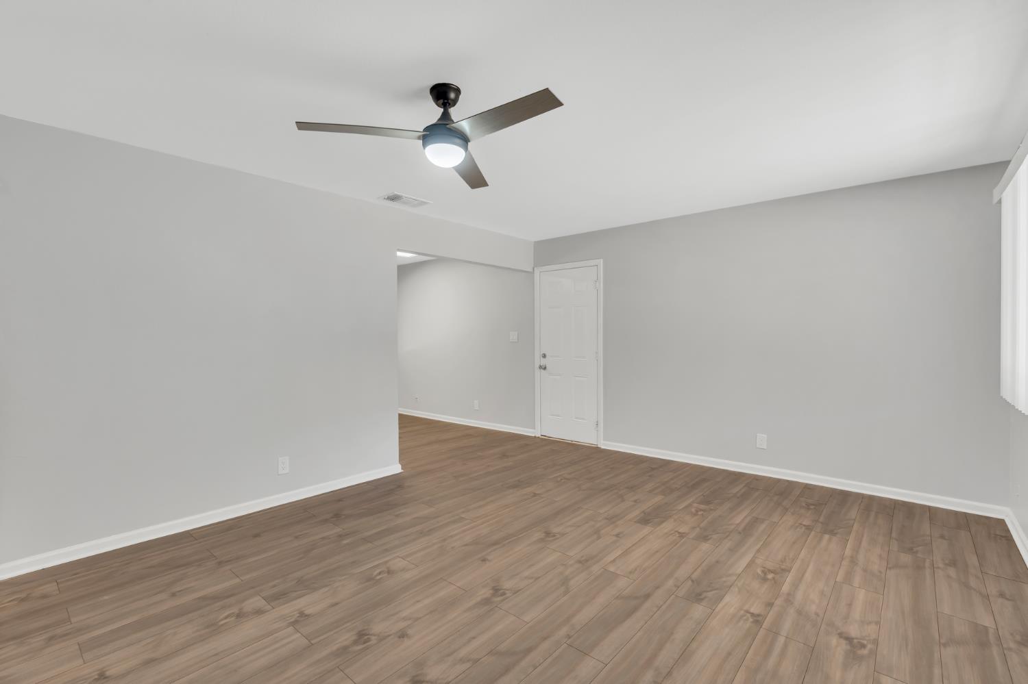 5720 Riverside Boulevard Sacramento, CA 95822 - Photo 37 of 54 a view of a room with wooden floor closet and windows