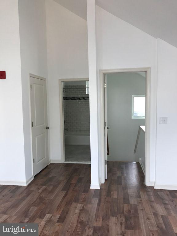 5261 Ridge Avenue, Unit 307 Philadelphia, PA 19128 - Photo 2 of 7 an empty room with wooden floor and entrance
