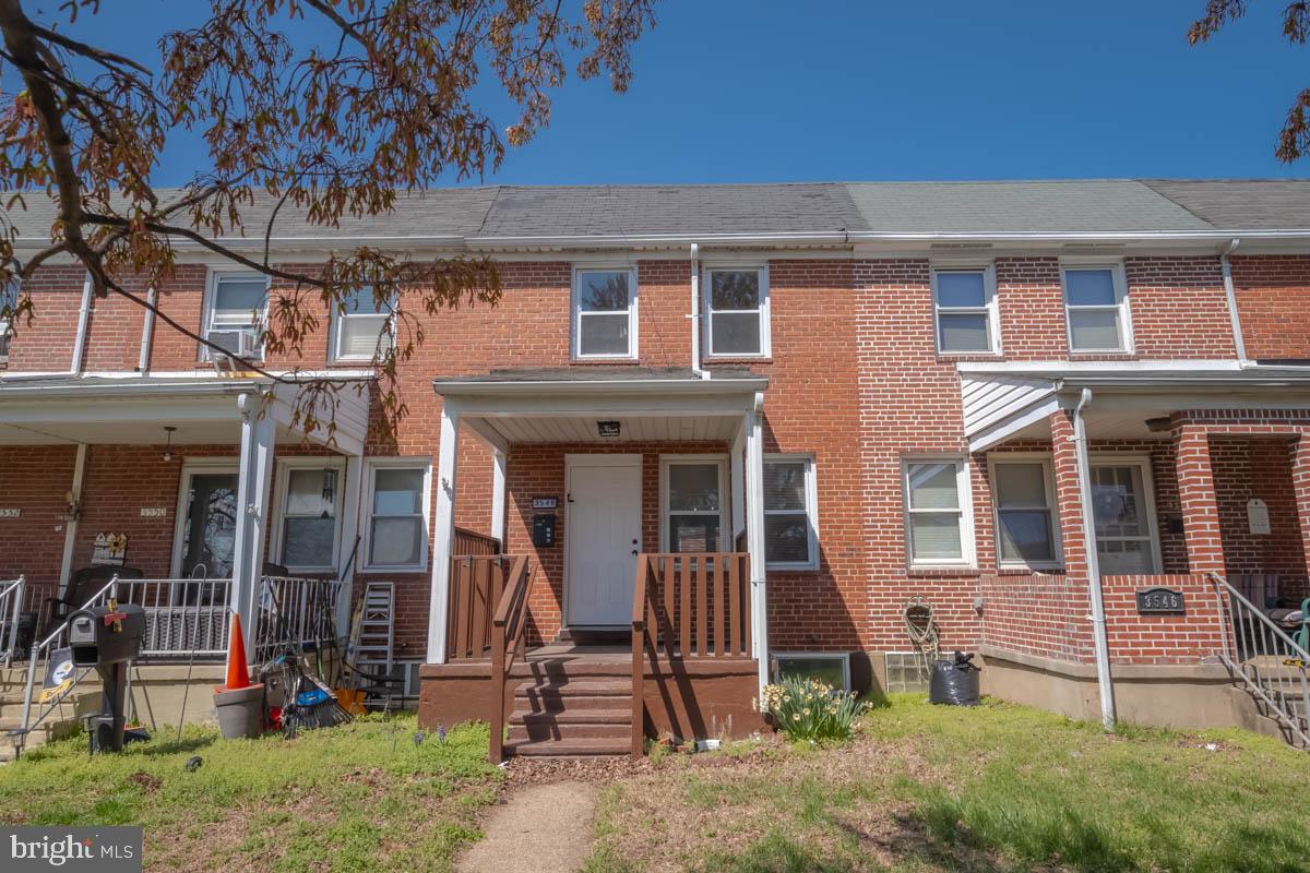 front view of a building with a garden