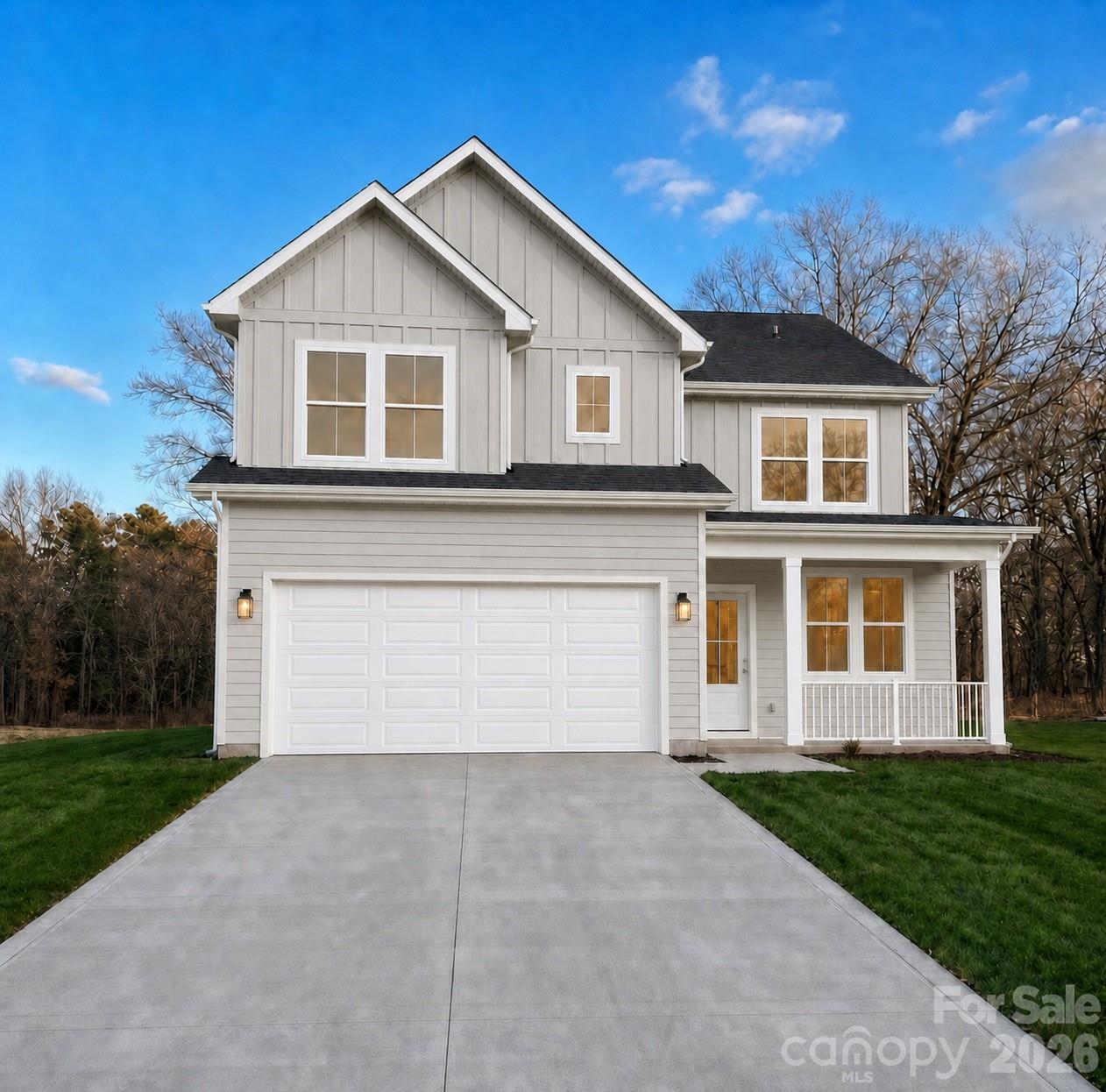 9020 Unity Church Road Mooresville, NC 28115 - Photo 1 of 34 a front view of a house with a yard and garage